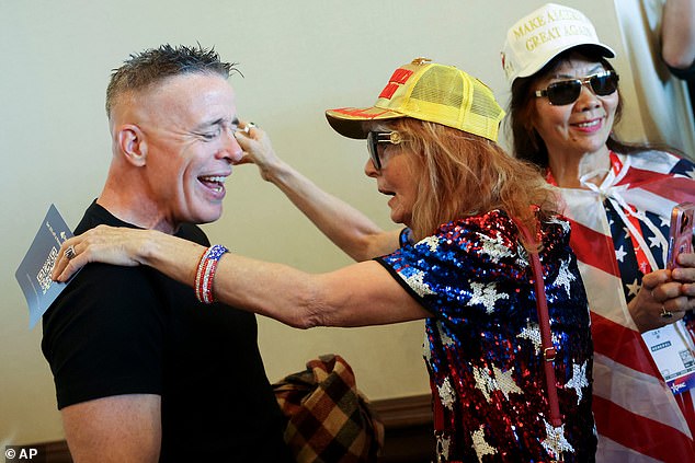 Former border patrol chief Greg Bovino is greeted by an attendee during the Conservative Political Action Conference